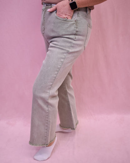 light olive denim with a frayed hem