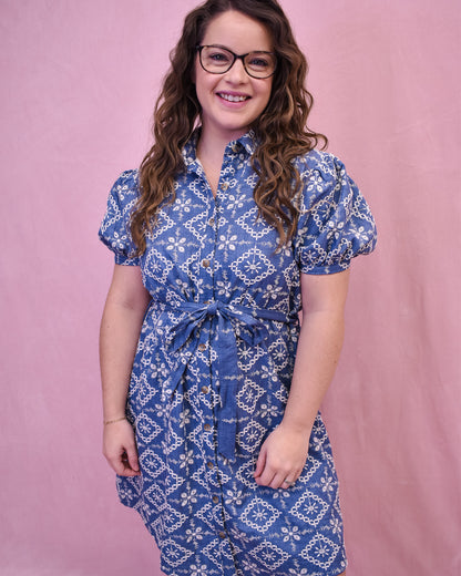 Puff Sleeve Chambray dress with embroidered floral. Button down with a belt tie at the waist.