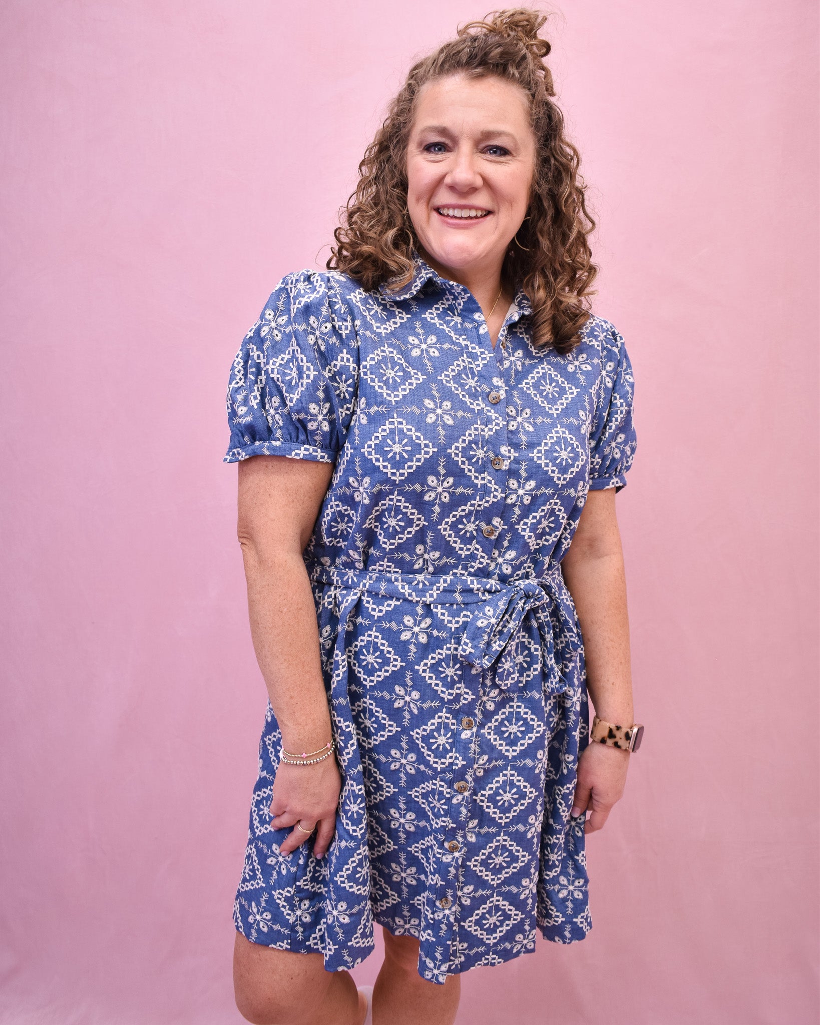 Puff Sleeve Chambray dress with embroidered floral. Button down with a belt tie at the waist.