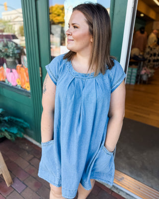 a cap sleeve pleated front denim mini dress with pockets 