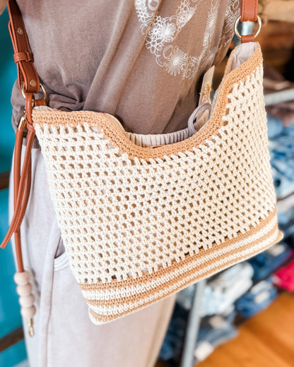 Woven crochet handbag with leather straps 