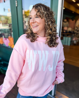 a pullover mock neck reversible sweatshirt with the words WWJD and Amen