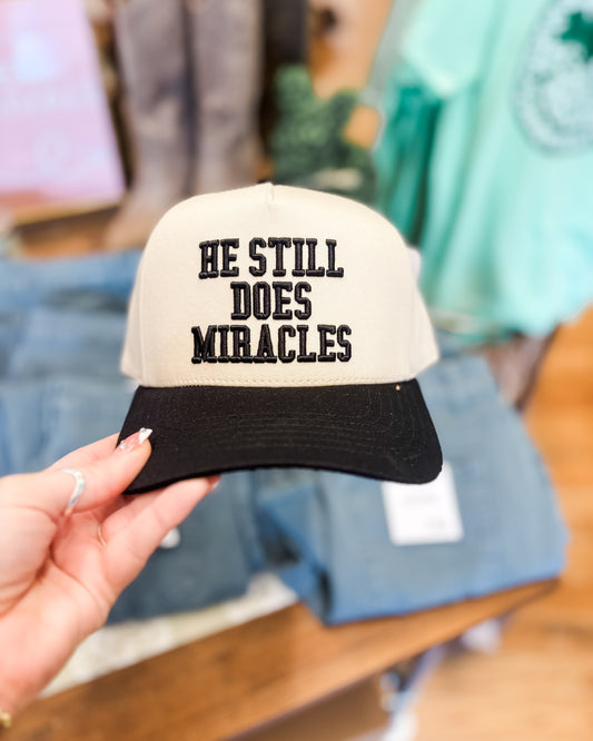 a canvas embroidered hat with black bill