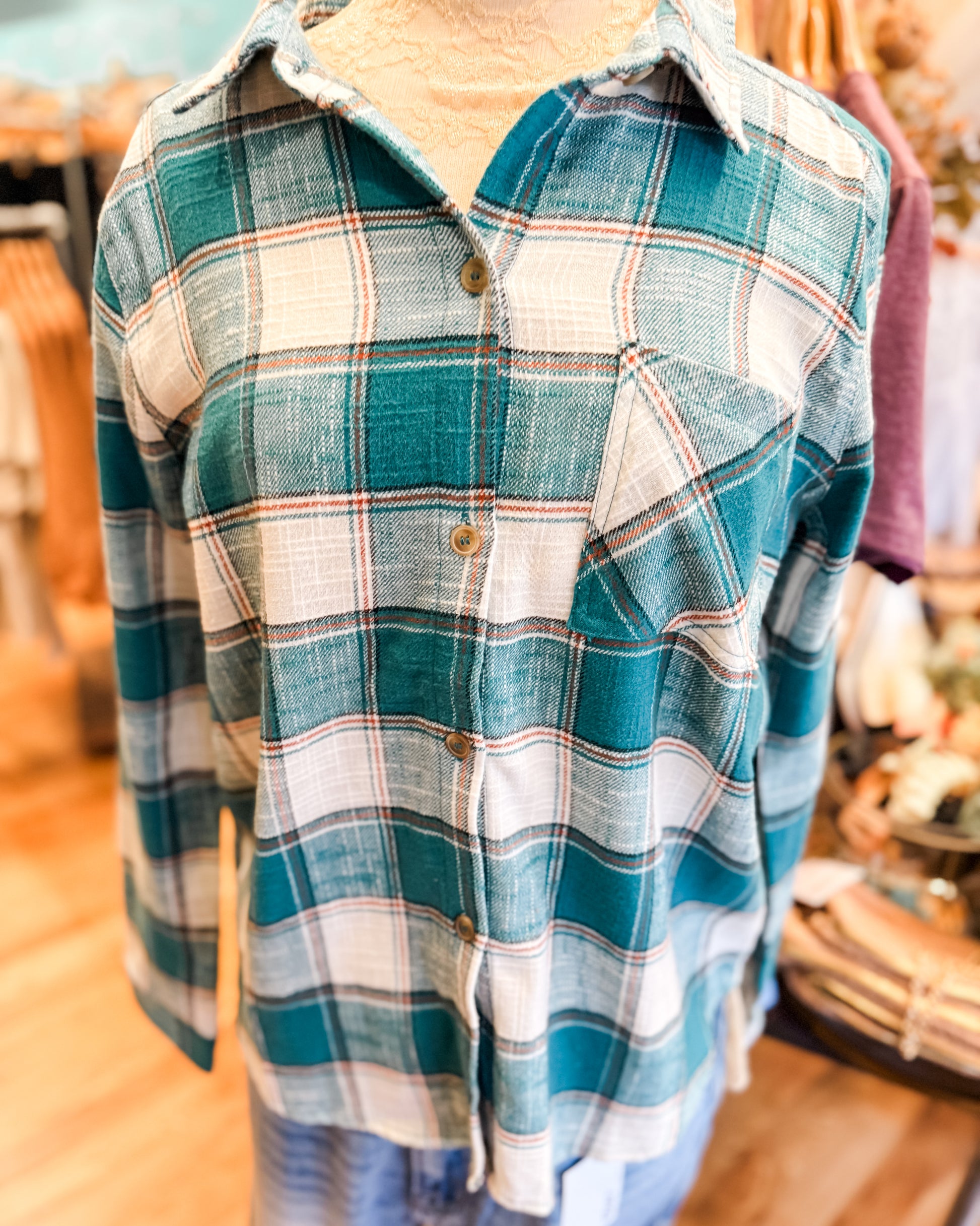 Plaid shirt on a mannequin in a store setting