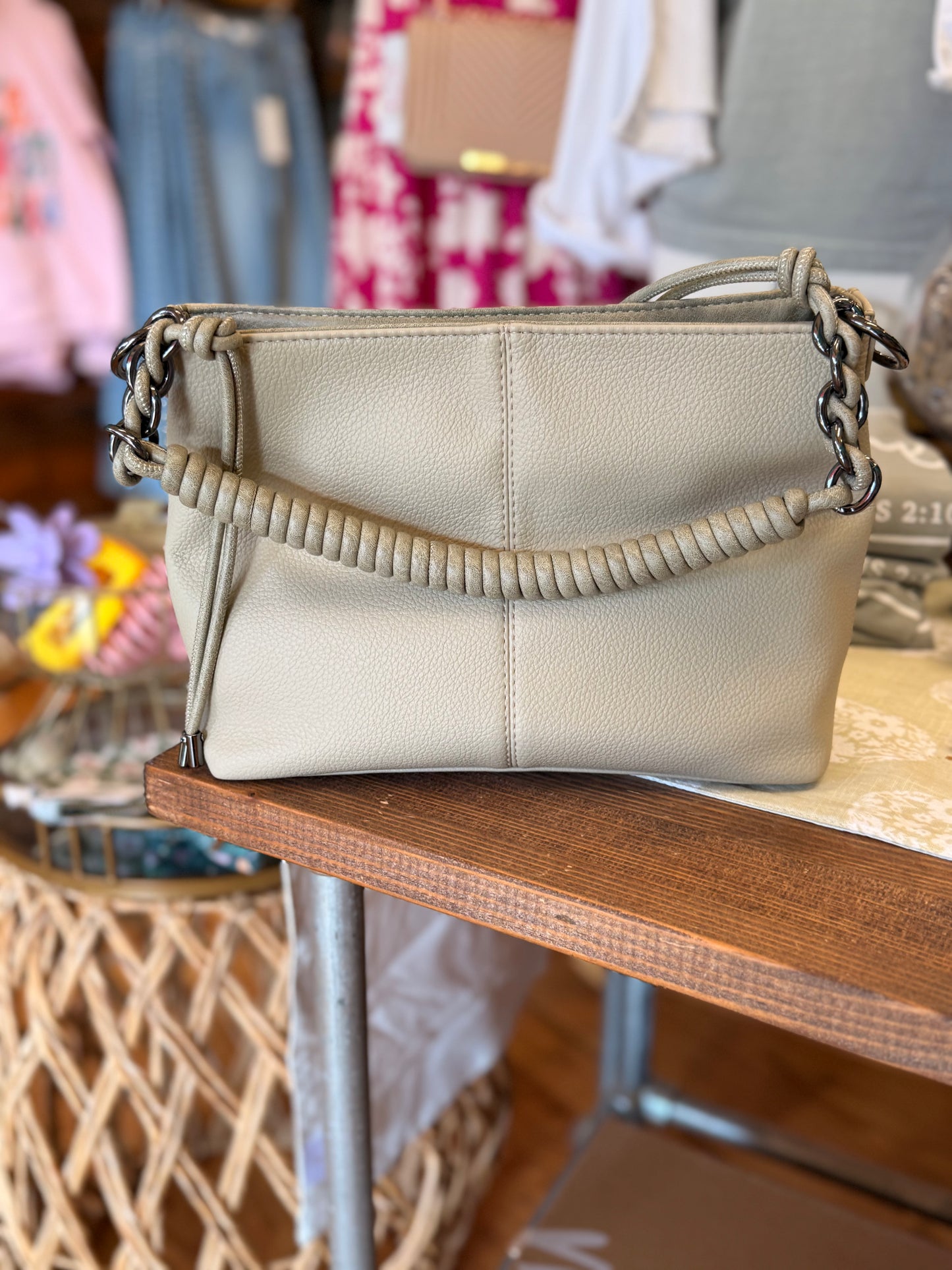 Handbag with leather woven chain detail handle