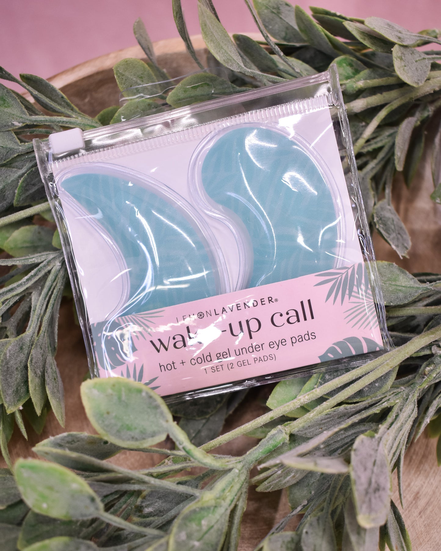 Pack of eye gel pads with lavender scent on a leafy background