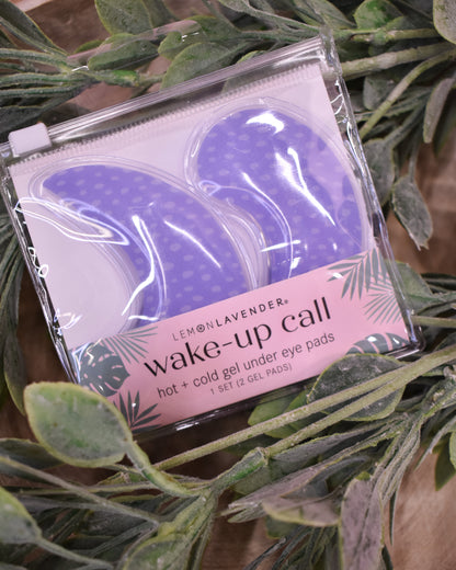 Pack of 'wake-up call' gel under eye pads with a pink label on green leaves.