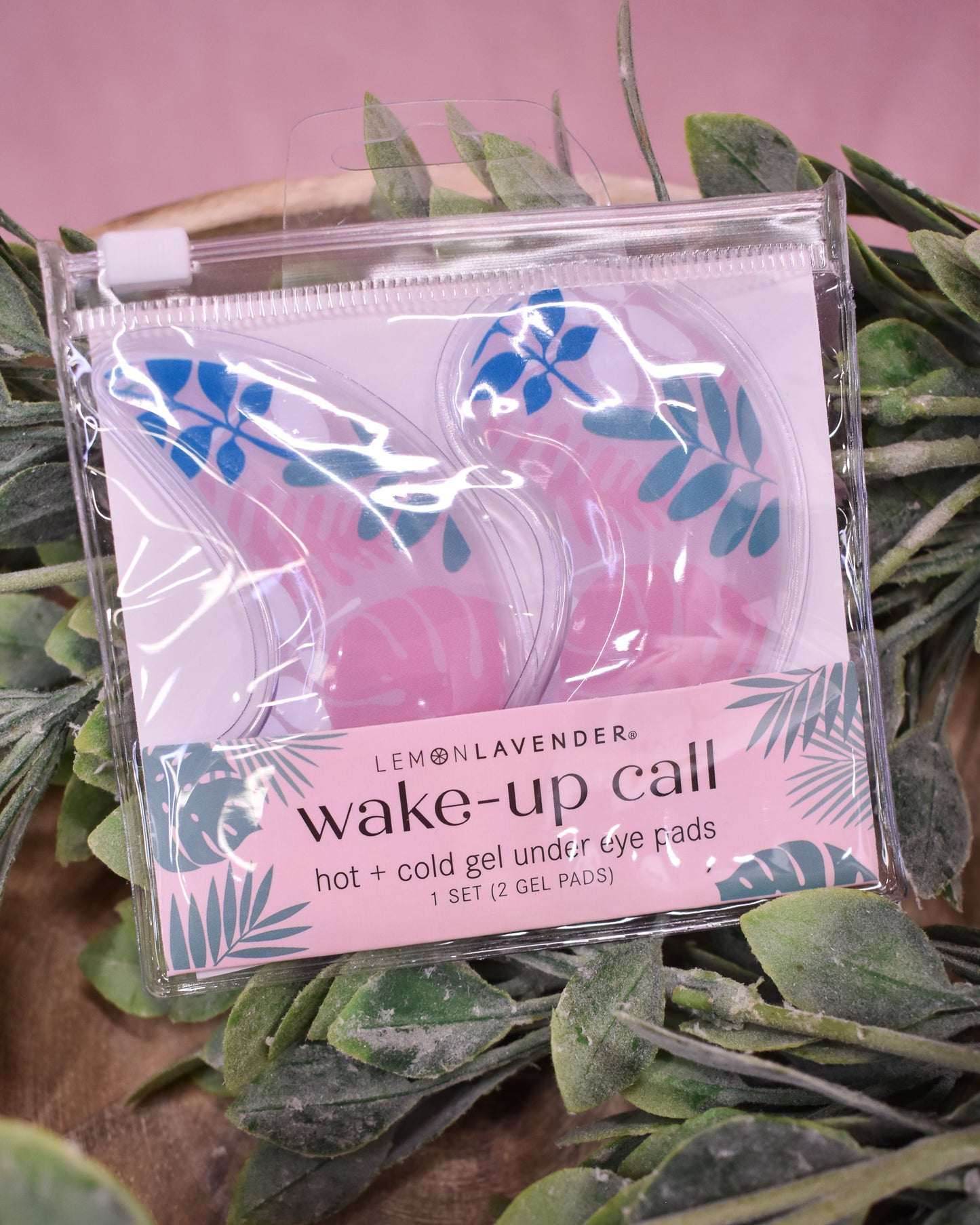 Packaged Lemon Lavender wake-up call eye gel pads on a leafy background