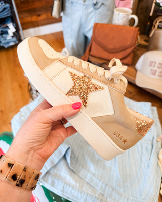 a gold glitter star low heel sneaker