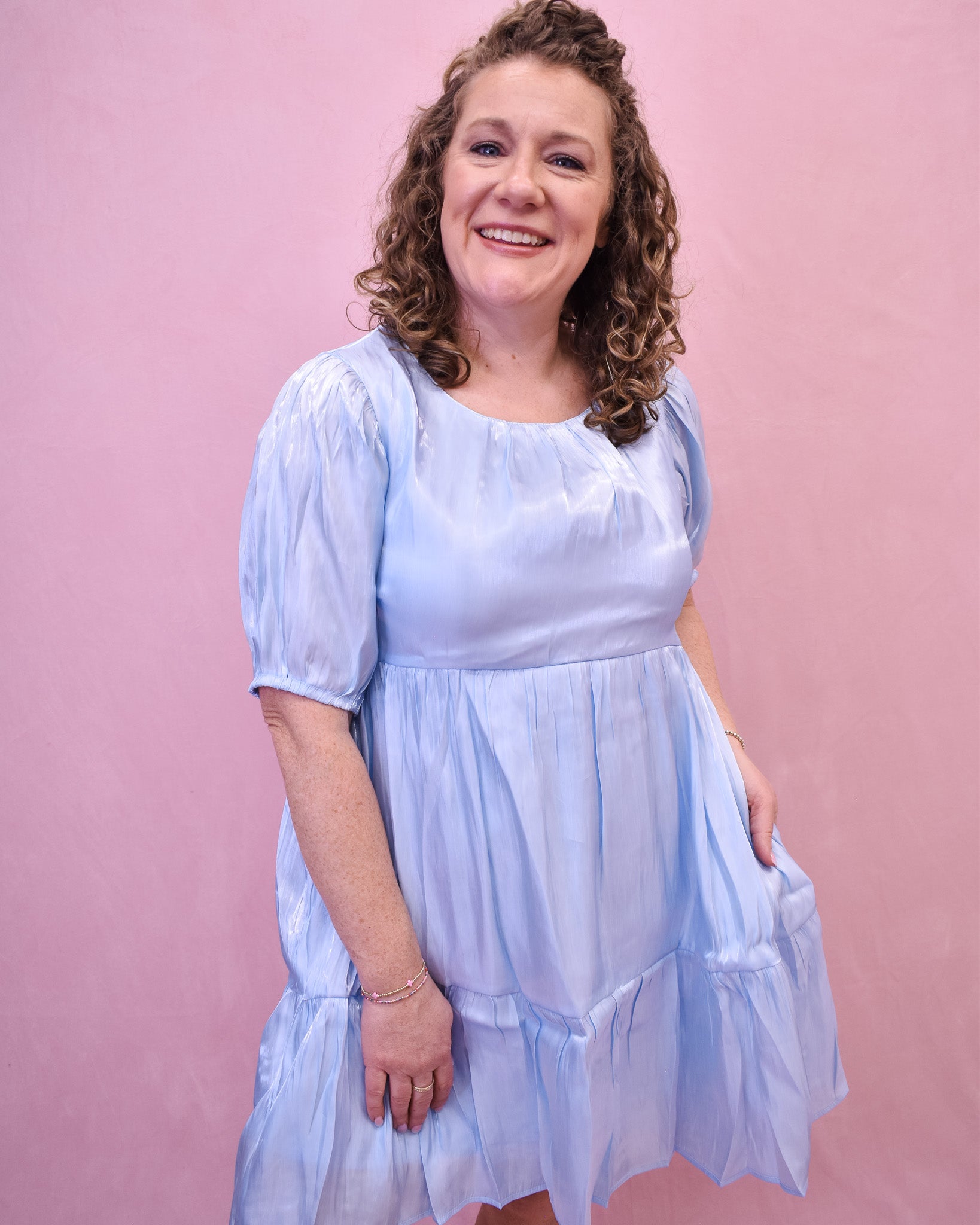 a satin tiered mini dress in a powder blue