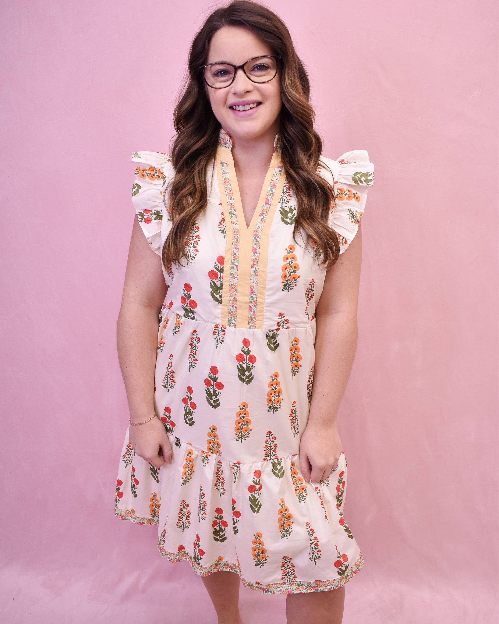 Cream colored floral mini dress with flutter sleeves