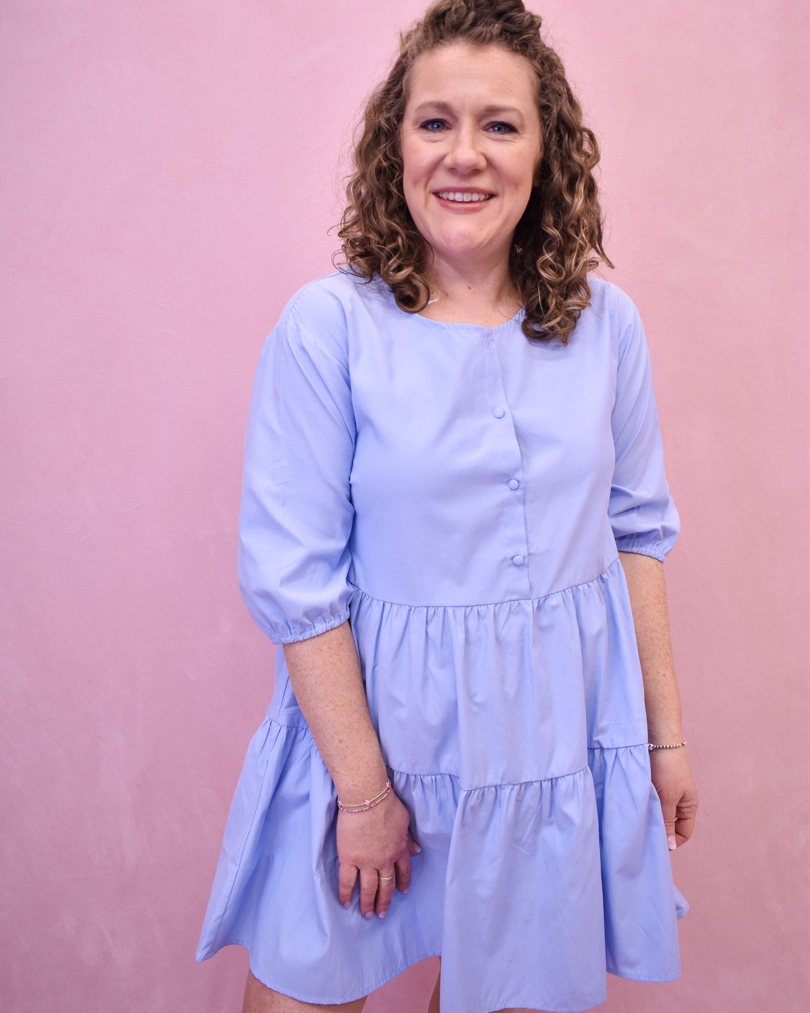 a light chambray colored tiered dress with front buttons