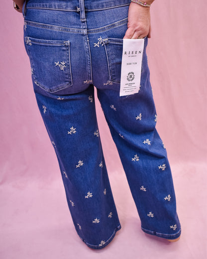 Floral embroidered jeans by risen denim.  Wide leg style, ankle length.
