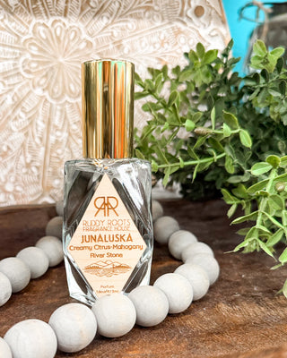 a clear bottle of perfume