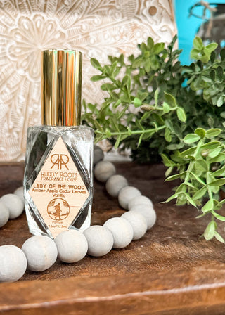 A clear bottle of perfume