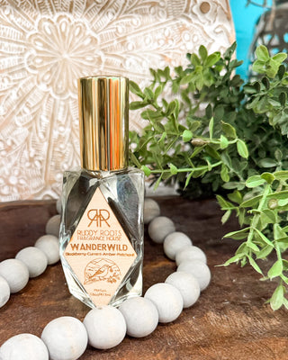 a clear bottle of perfume