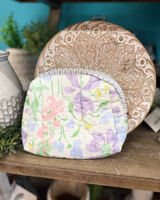 a watercolor blue floral zip up cosmetic bag