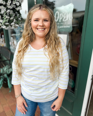 a vneck yellow striped 3/4 sleeve top