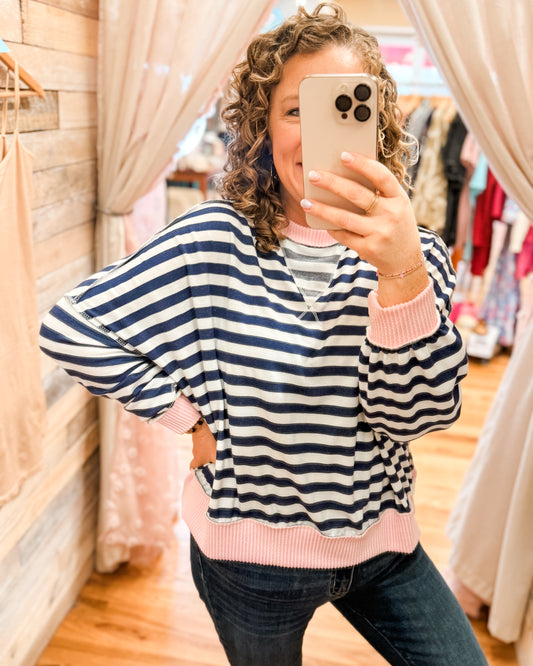 A striped long sleeve pullover style top. Oversize fit, buttery soft, hits at the waist.