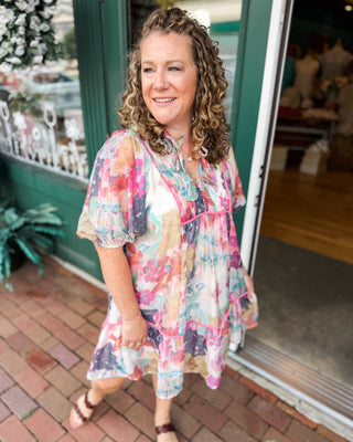 a watercolor drop hem midi dress with pink piping