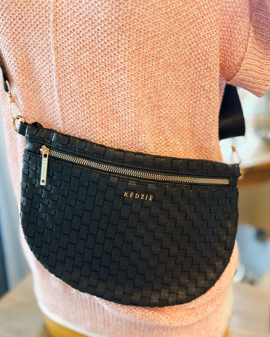 a black woven crossbody style bag