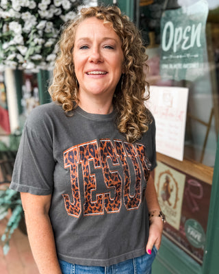 a black crop baby tee with JESUS leopard print graphic