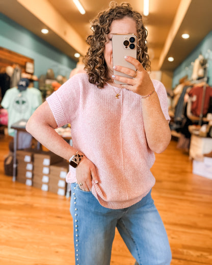 A lightweight short sleeve light pink sweater